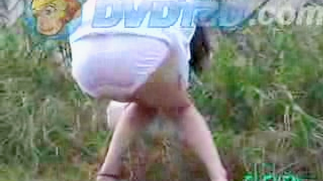 Obedient and cute japanese doll is ing outdoors