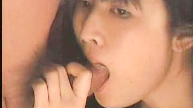 Japanese vixen with dark hair is sucking big stick