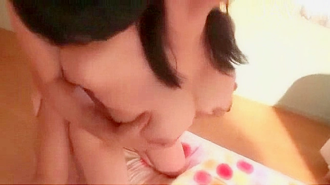 Dark haired and cute asian babe is jumping on big stick
