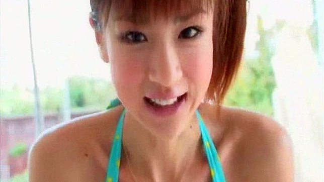 Beautiful Japanese undulates her sexy forms on cam