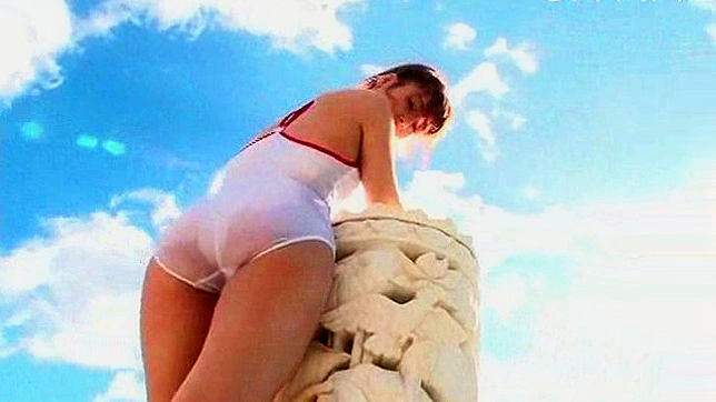 Attractive asian teen with good mood is showing her butt
