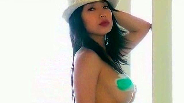 Busty japanese solo girl is demonstrating her melons outdoors