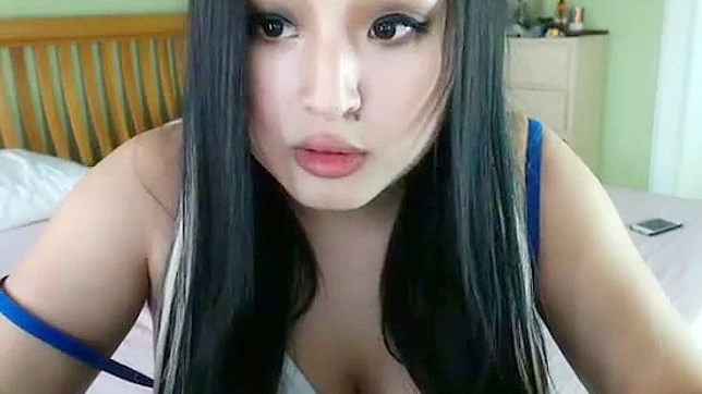 Desiring sexy chick Asian Flowerr works as model and plays dirty games in front of camera