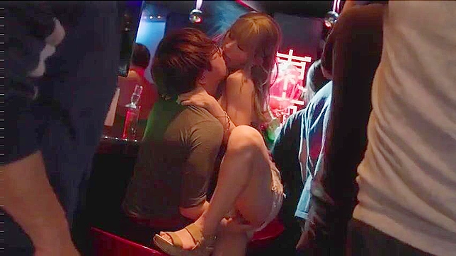 Japanese chick is the center of the attention as she services some stiff dicks