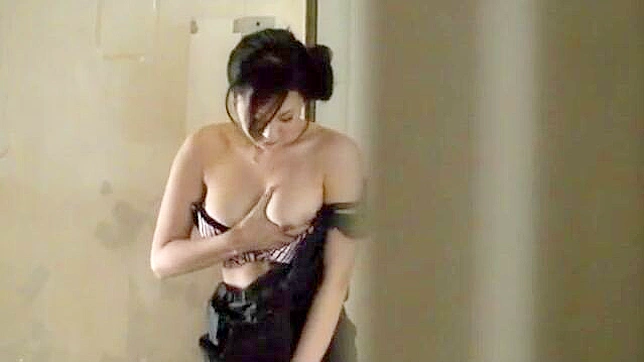 Naughty mature japanese woman pleasures herself in public, reaching climax on the balcony.